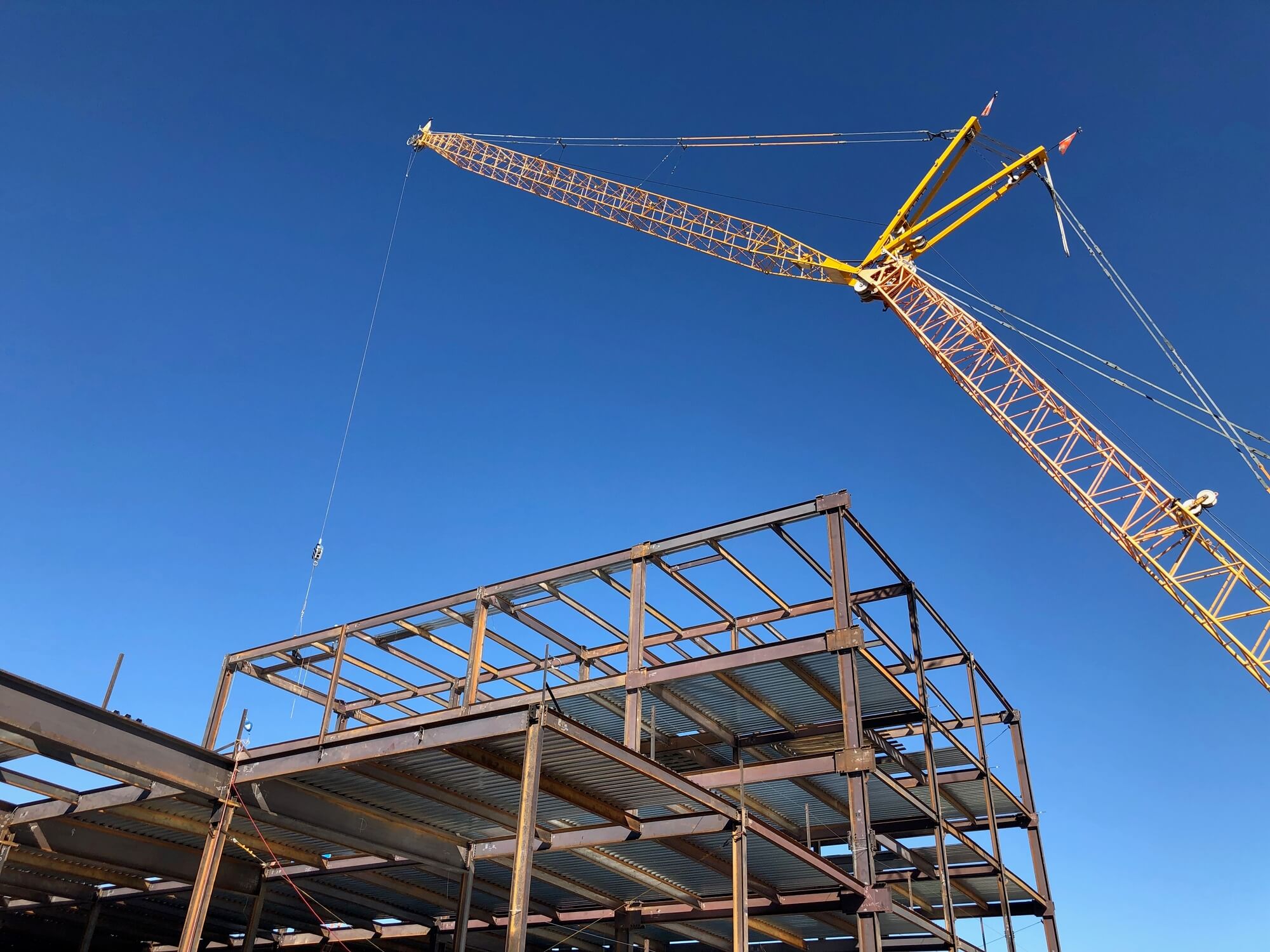 crane erecting steel beam